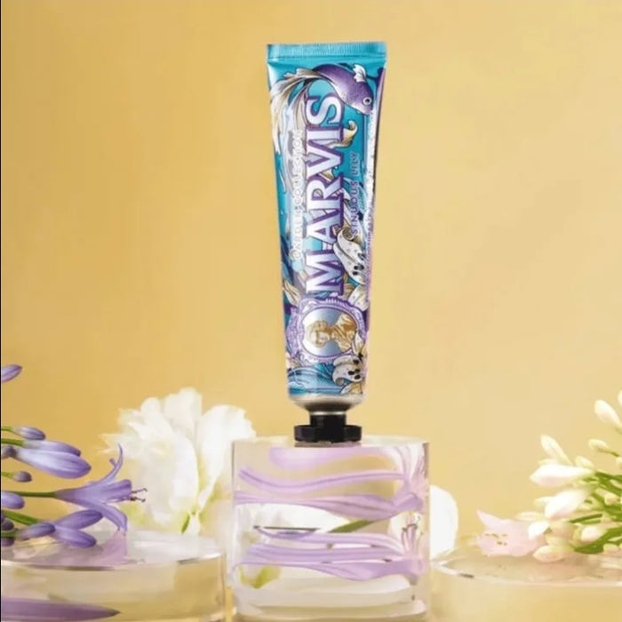 Marvis toothpaste tube with floral background